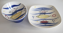 Load image into Gallery viewer, Stavangerflint Norway 1950s 1960s MCM atomic midcentury pottery with red yellow and blue fishes in cobalt blue waves, Gray Barn Eclectic Finds online vintage store, plate and bowl, side angle to show slope on bowl and curve on plate sides